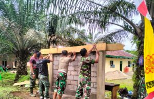Satgas TMMD Ke-123 Kodim 0416/Bute Kebut Pembuatan Papan Nama MI Nurul Falah
